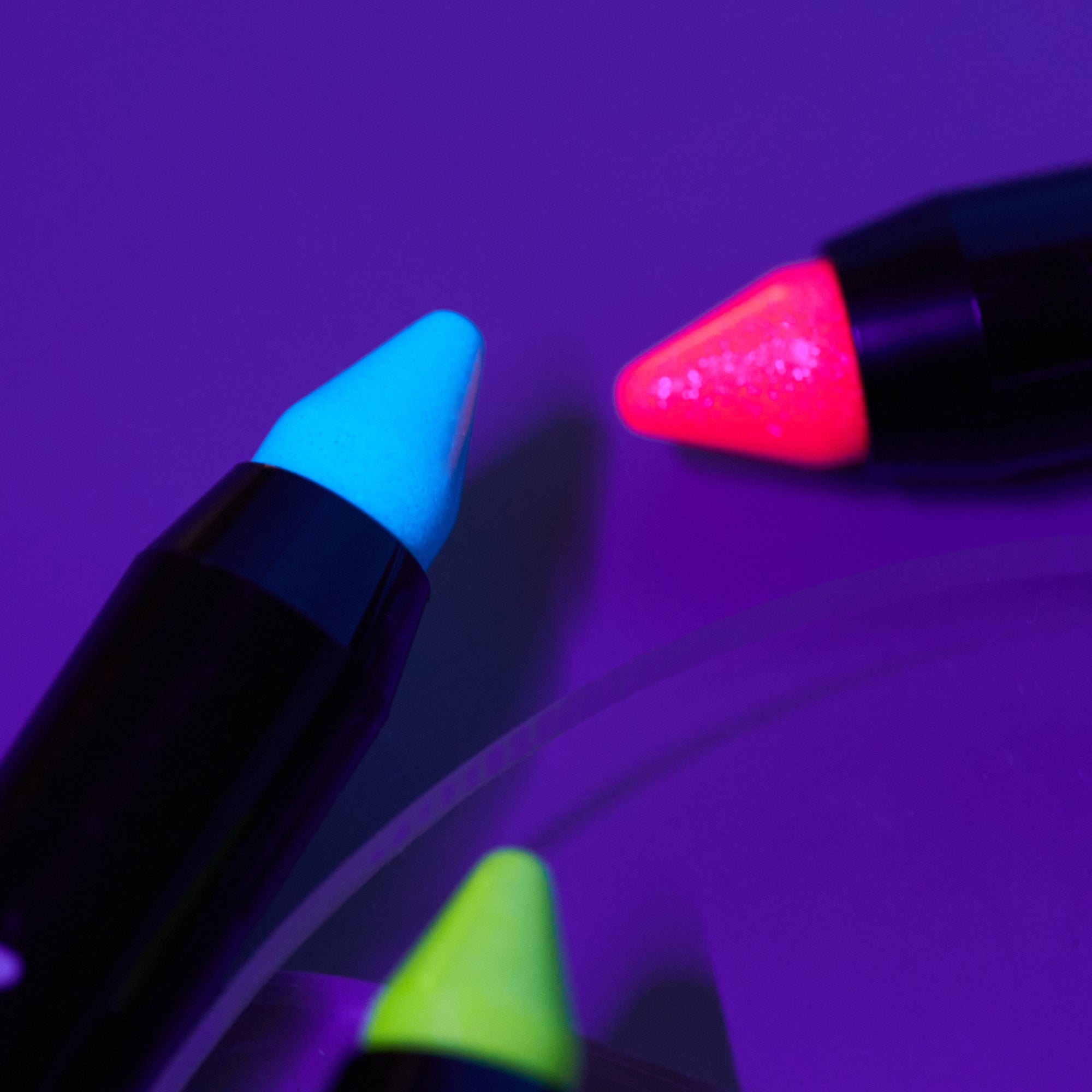 Neon UV Glow Blacklight Glitter Face & Body Crayons. Cosmetically certified, FDA & Health Canada compliant and cruelty free.